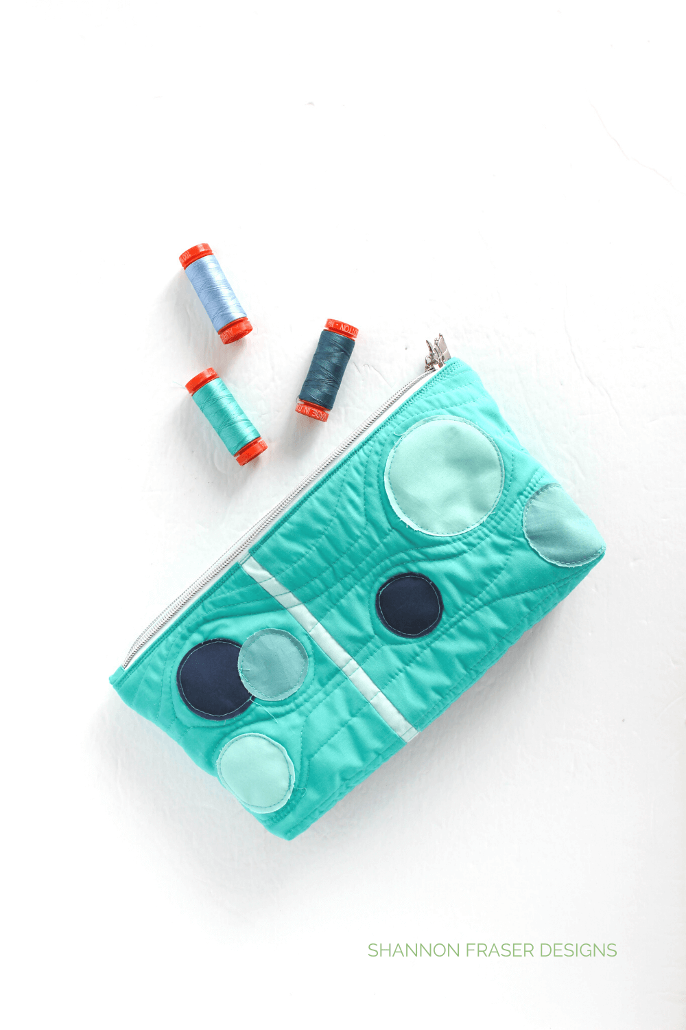 Pale Blue Dot Zip Pouch by Shannon Fraser Designs for the Slice and Stitch Challenge hosted by Aurifil Thread and Olfa. This one was all about diving into raw edge appliqué circles - sew fun! #rawedgeapplique #zippouch