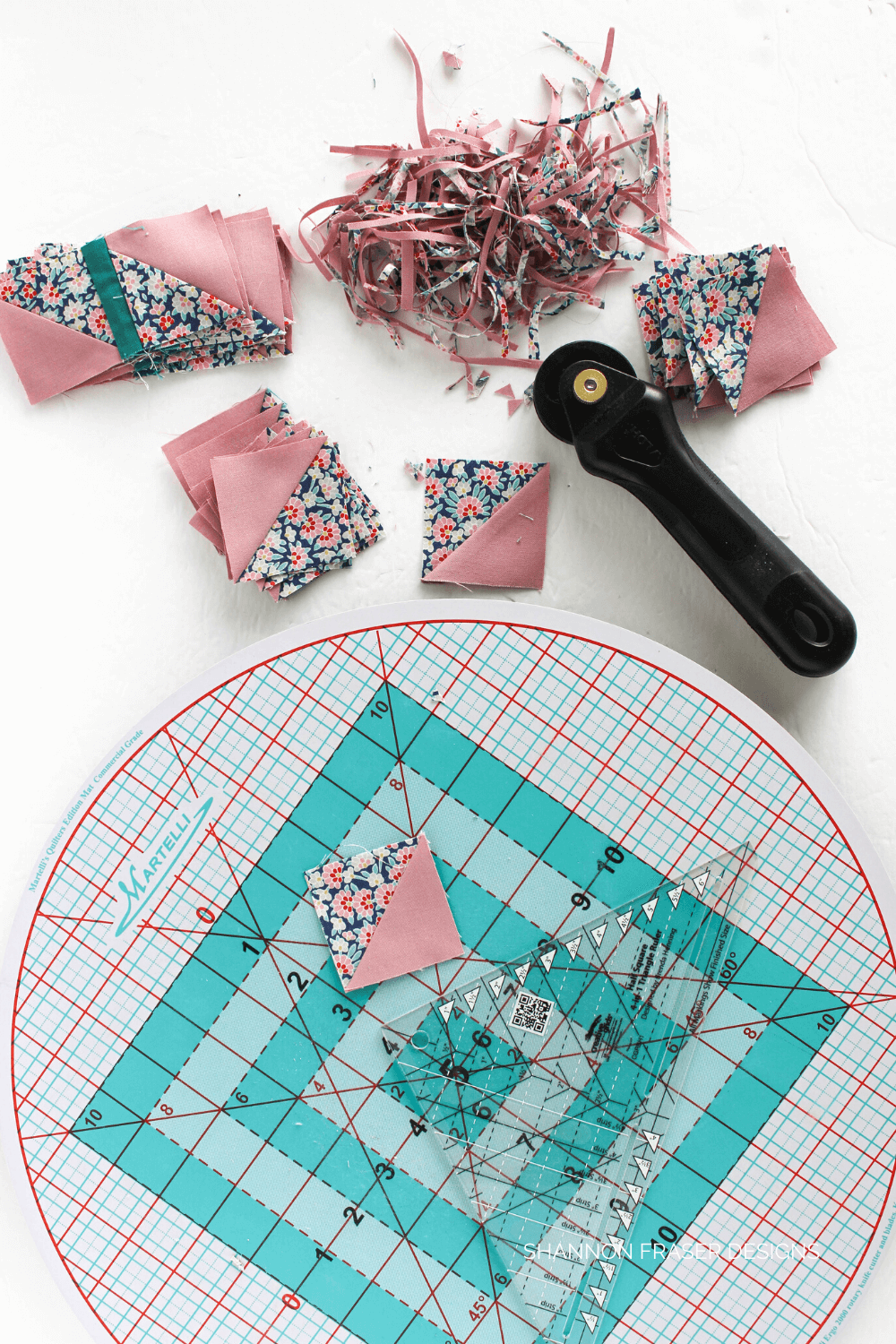 Top 3 Notions for efficient half square triangle trimming by Shannon Fraser Designs: roundabout cutting mat is so helpful is making quick work of trimming your HST blocks. This one spins like no other! #quilttips #notions #quilting