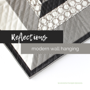 Reflections quilted wall hanging featuring upcycled fabrics | A Suzy Quilts Pattern #quiltedwallhanging