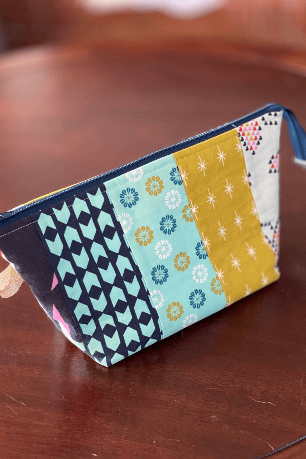 Outside view of Cheryl Brickey of Meadow Mist Designs sewing bag that was handmade by a friend. See more on the blog over at Shannon Fraser Designs #whatsinyoursewingbag #sewingnotions #zippouch