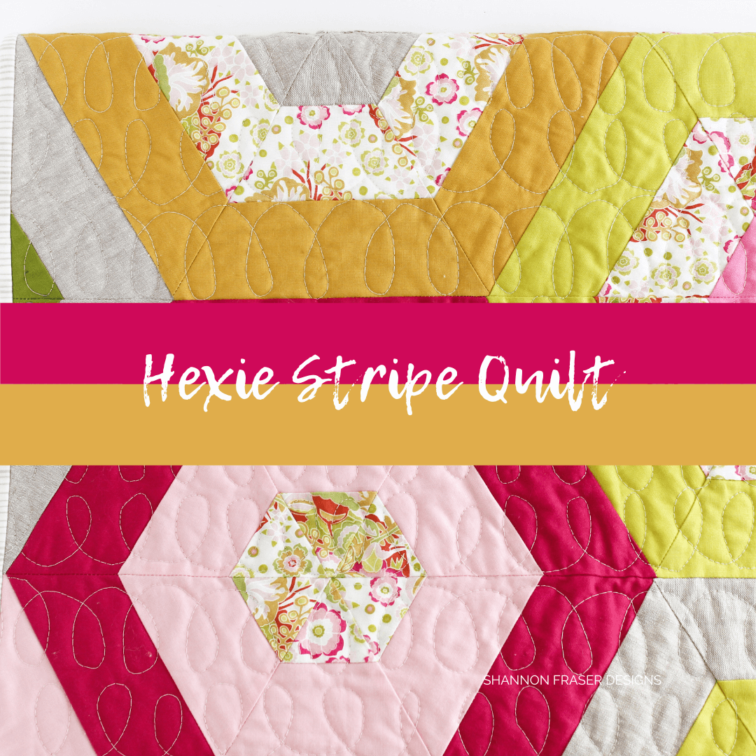 Hexie Stripe is a fun modern quilt pattern by Suzy Quilts that's perfect for learning how to piece on the bias. This quilt is also fun to play with different fabric colours and prints. See more photos on the blog #hexiequilt #quiltpattern #modernquiltpattern