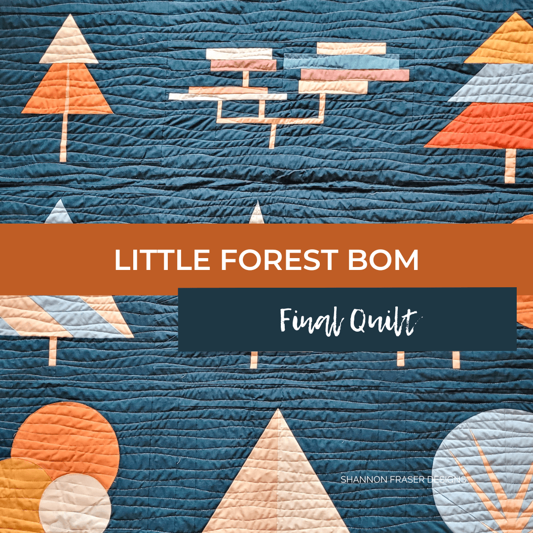 Need inspiration for a Block of the Month quilt? This finished Little Forest quilt combines cool ombré blues with warm sunset-inspired accents for a fresh take on modern quilting. #BOMQuilt #BlockOfTheMonth #ModernQuilt #QuiltAlong #QuiltInspiration #BlueQuilt #QuiltColourPalette #LittleForestQuilt
