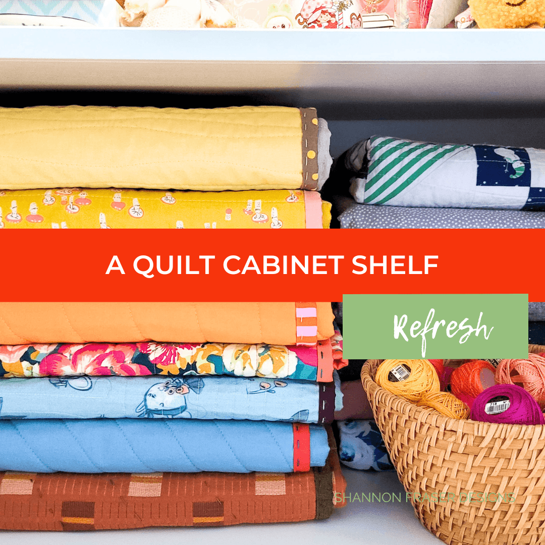 My Block of the Month quilt shelf had officially reached capacity—until one small adjustment helped me use the available space more efficiently. See the before and after and discover how to keep your quilt storage organization working as your collection grows. #QuiltStorage #QuiltOrganization #SewingRoomOrganization #QuiltCabinet #ModernQuilting